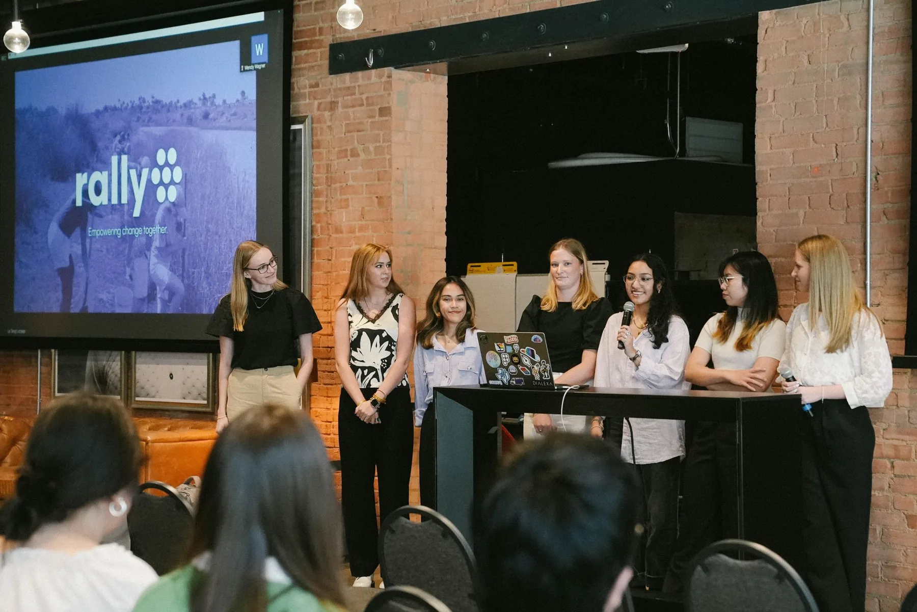 The Rally team presenting final designs on stage