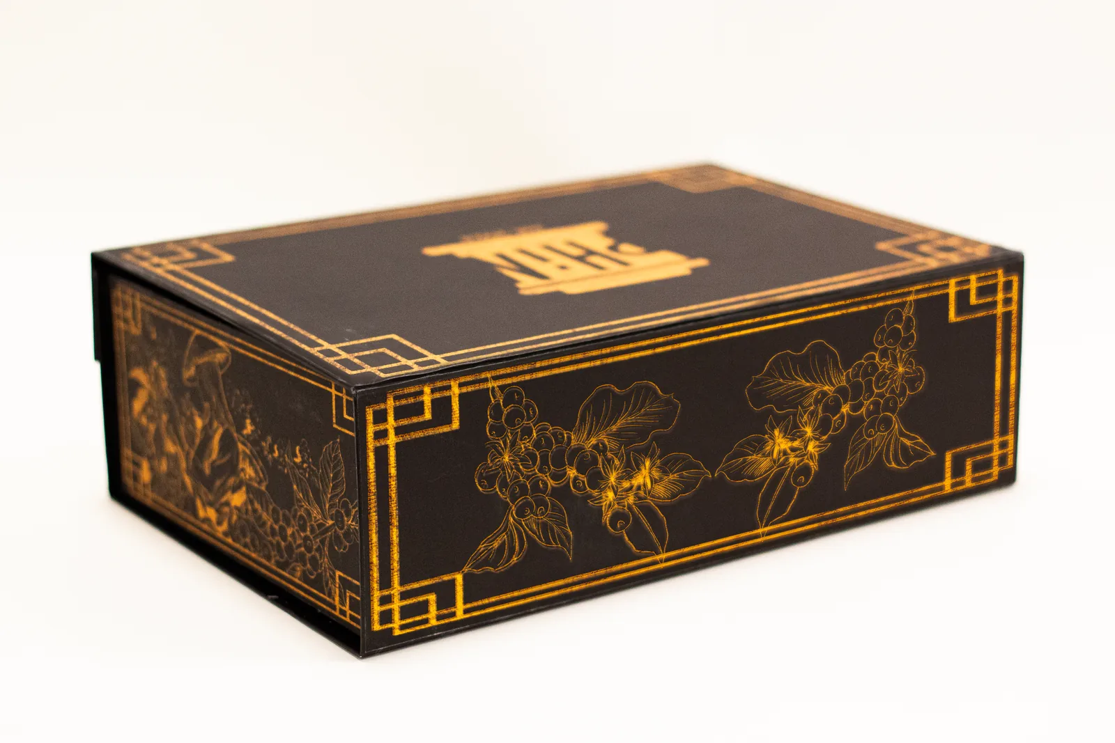 Black and gold Phin gift box with coffee-branch illustrations
